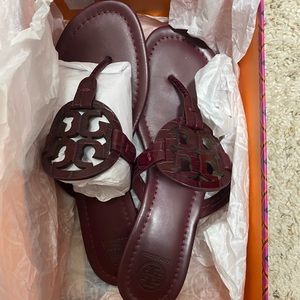 New Tory Burch size 8 in color Claret which is a deep maroon.